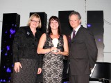 Christine Desjardine accepts her award with Strategy executive editor Mary Maddever on the left and new P&G president Thom Lachman on the right.